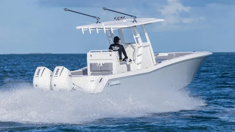  Yacht Photos Pics 2025 Invincible 33 Open Fisherman speeding on ocean waters.