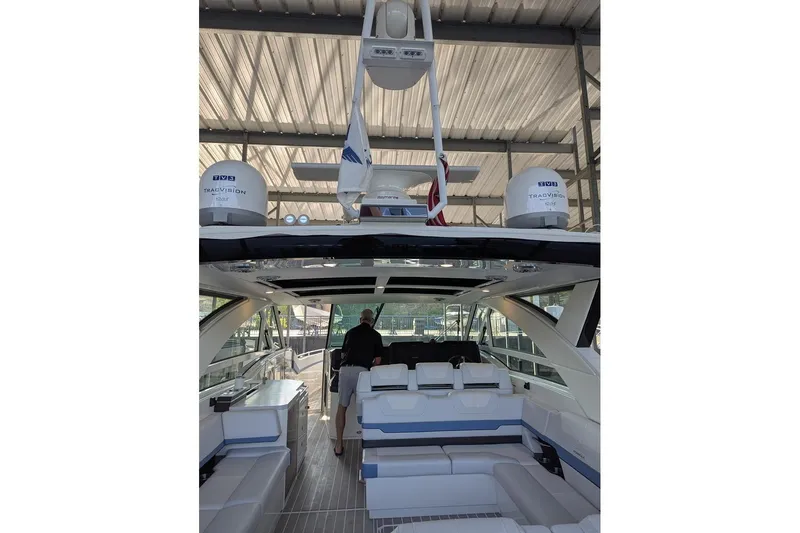  Yacht Photos Pics 2024 Formula 430 Super Sport Crossover luxury yacht interior with seating and advanced navigation equipment.