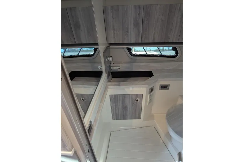  Yacht Photos Pics 2024 Formula 430 Super Sport Crossover interior with modern cabinetry and window.