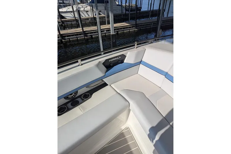  Yacht Photos Pics 2024 Formula 430 Super Sport Crossover boat interior with white and blue seating.