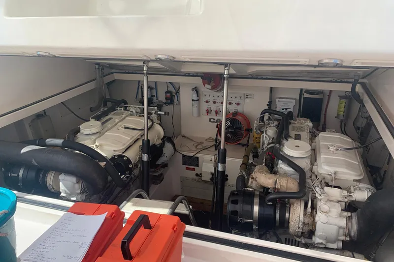 Dream Weaver Yacht Photos Pics Engine room of a 2002 Cabo 35 Express boat, featuring dual engines and equipment.
