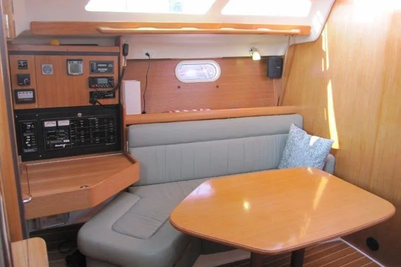 Sassy Cat Yacht Photos Pics Interior of 2004 Catalina 350 MkII sailboat with navigation station and cozy seating area.