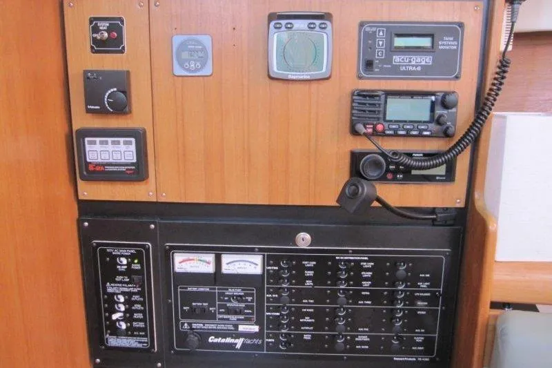 Sassy Cat Yacht Photos Pics Control panel of a 2004 Catalina 350 MkII sailboat with navigation and communication equipment.