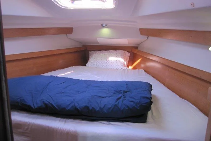 Sassy Cat Yacht Photos Pics Cozy cabin interior of 2004 Catalina 350 MkII sailboat with bed and bedding.