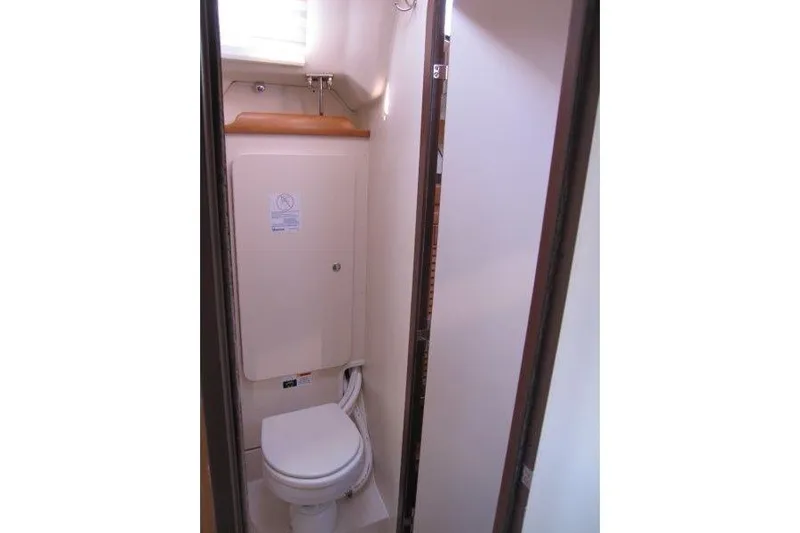 Sassy Cat Yacht Photos Pics Compact bathroom in a 2004 Catalina 350 MkII sailboat, featuring a marine toilet.