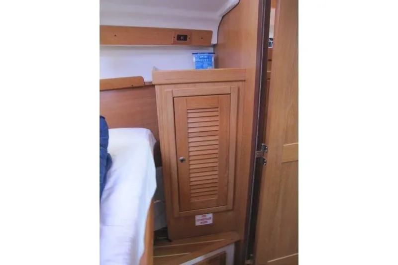 Sassy Cat Yacht Photos Pics Interior of 2004 Catalina 350 MkII sailboat with wooden cabinet and bed.