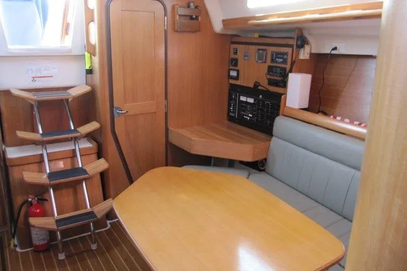 Sassy Cat Yacht Photos Pics Interior of a 2004 Catalina 350 MkII sailboat with wooden furnishings and navigation equipment.