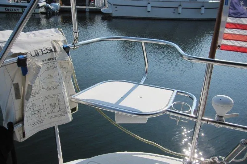 Sassy Cat Yacht Photos Pics Sailboat stern view with lifebuoy holder, Catalina 350 MkII, 2004 model, docked in marina.