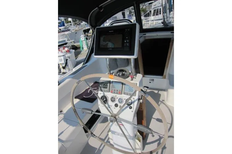 Sassy Cat Yacht Photos Pics Cockpit of 2004 Catalina 350 MkII sailboat with navigation equipment and steering wheel.