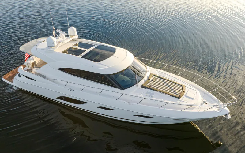 Ohana Yacht Photos Pics 2017 Riviera Sport Cruiser yacht on calm water, aerial view.