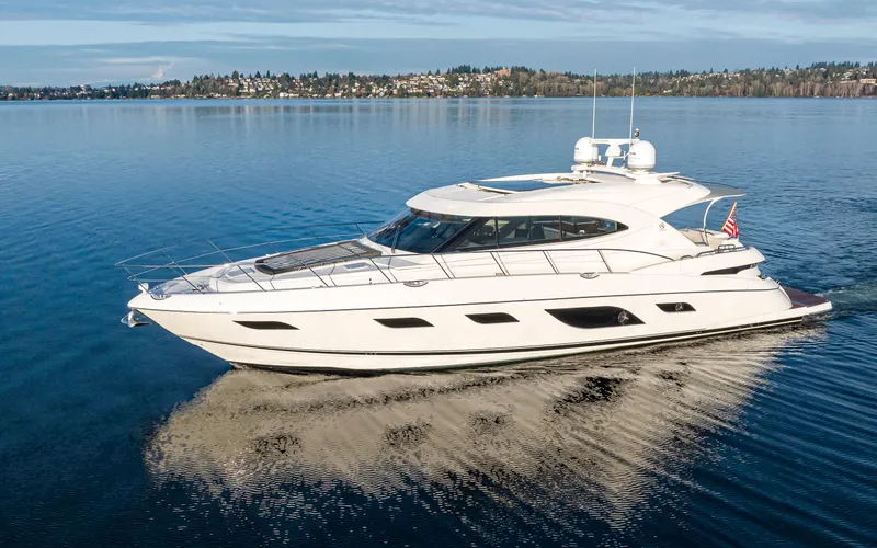 Ohana Yacht Photos Pics 2017 Riviera Sport Cruiser yacht on calm water, showcasing sleek design and luxury features.
