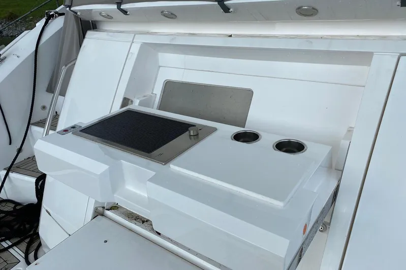  Yacht Photos Pics Outdoor kitchen on 2017 Sunseeker Manhattan 52 yacht with grill and cup holders.