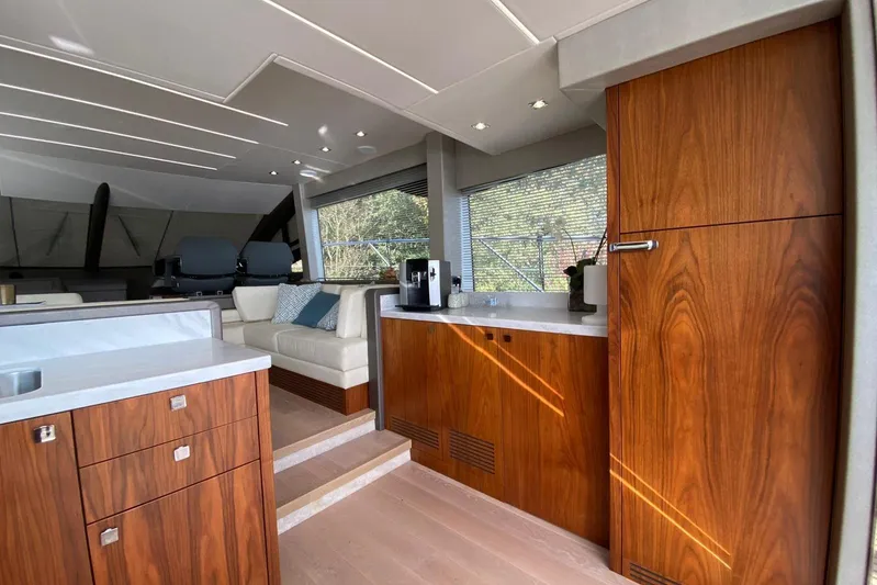  Yacht Photos Pics Luxurious interior of 2017 Sunseeker Manhattan 52 yacht with elegant wood cabinetry.
