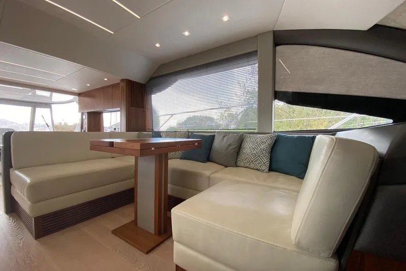  Yacht Photos Pics Luxurious interior of 2017 Sunseeker Manhattan 52 yacht with elegant seating and modern decor.