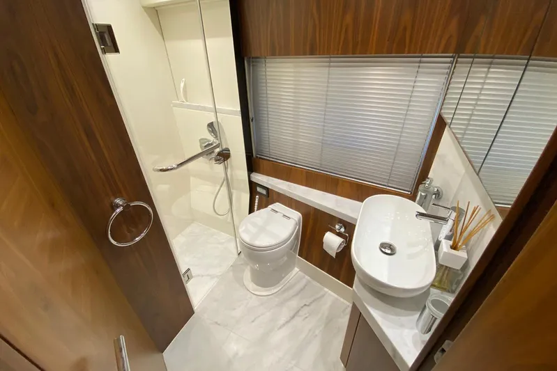  Yacht Photos Pics Luxurious bathroom in 2017 Sunseeker Manhattan 52 yacht with modern fixtures and elegant design.