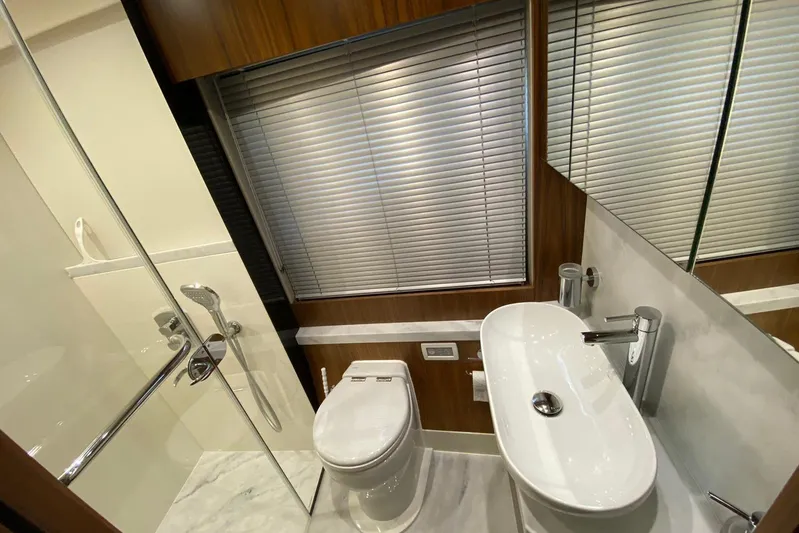  Yacht Photos Pics Luxurious bathroom in 2017 Sunseeker Manhattan 52 yacht with modern fixtures and elegant design.