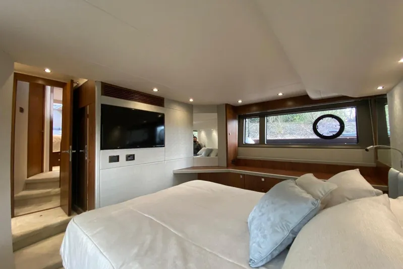  Yacht Photos Pics Luxurious bedroom interior of 2017 Sunseeker Manhattan 52 yacht with modern amenities.