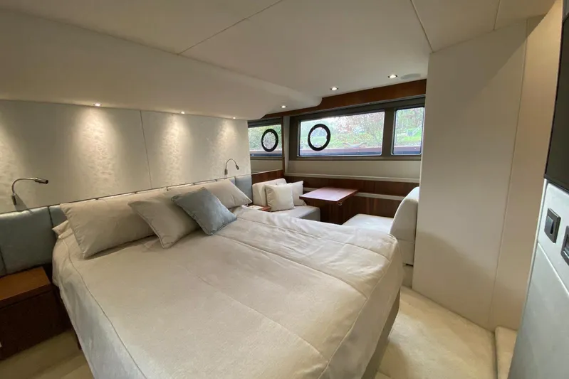  Yacht Photos Pics Luxurious bedroom interior of 2017 Sunseeker Manhattan 52 yacht with elegant furnishings.