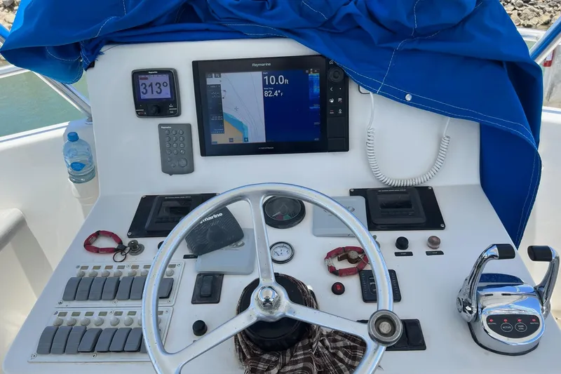 Pure Magic Yacht Photos Pics Control panel of a 2006 Island Hopper Sportfisher boat with navigation equipment.