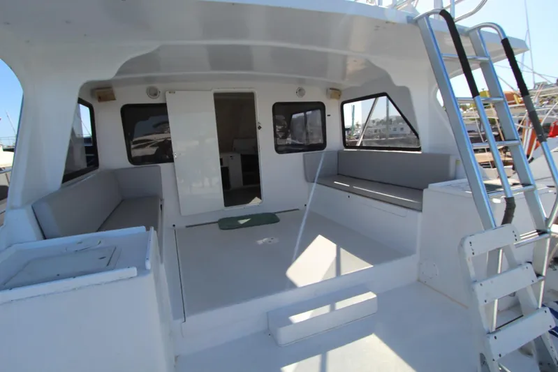 Pure Magic Yacht Photos Pics 2006 Island Hopper Sportfisher boat interior with seating and ladder.