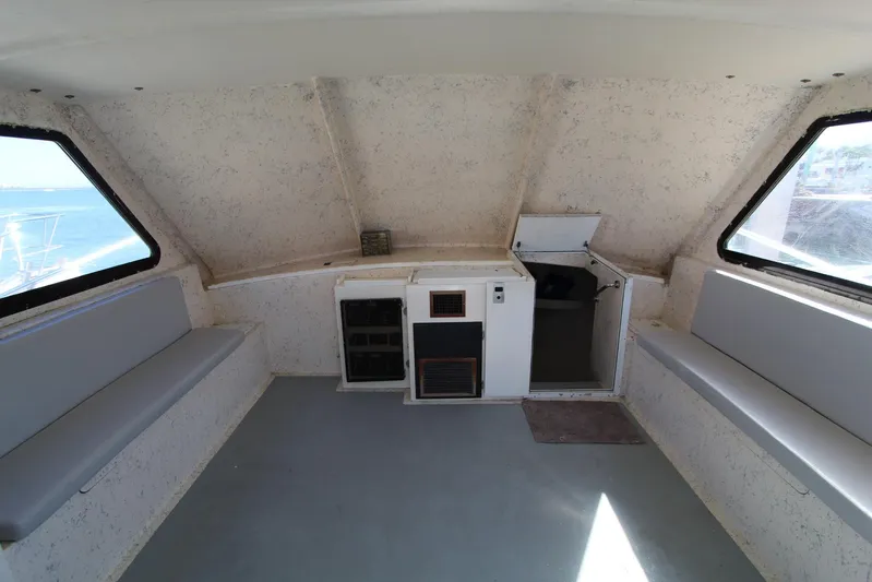 Pure Magic Yacht Photos Pics Interior of a 2006 Island Hopper Sportfisher boat with seating and storage.
