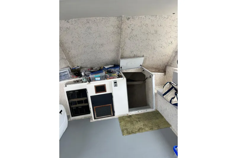 Pure Magic Yacht Photos Pics Interior of 2006 Island Hopper Sportfisher boat with storage compartments and equipment.