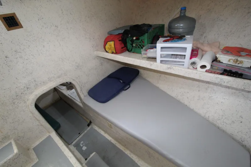 Pure Magic Yacht Photos Pics 2006 Island Hopper Sportfisher cabin interior with storage and sleeping area.