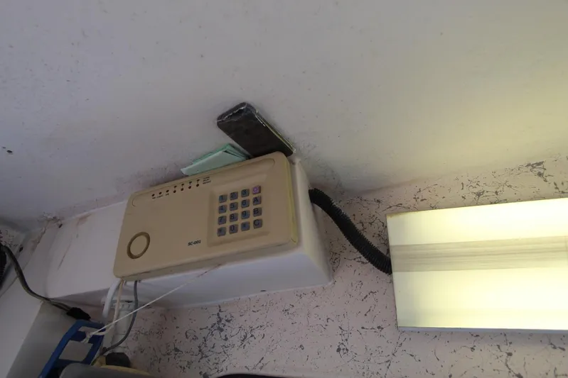 Pure Magic Yacht Photos Pics Wall-mounted keypad security system in a 2006 Island Hopper Sportfisher boat.