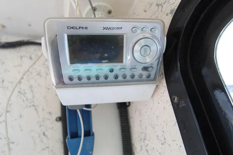 Pure Magic Yacht Photos Pics Delphi XM SkyFi2 radio on 2006 Island Hopper Sportfisher boat dashboard.