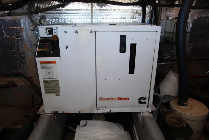 Pure Magic Yacht Photos Pics Cummins Onan generator in 2006 Island Hopper Sportfisher engine room.