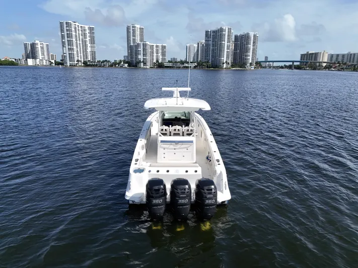  Yacht Photos Pics 2017 Boston Whaler 350 Outrage on water with city skyline backdrop.