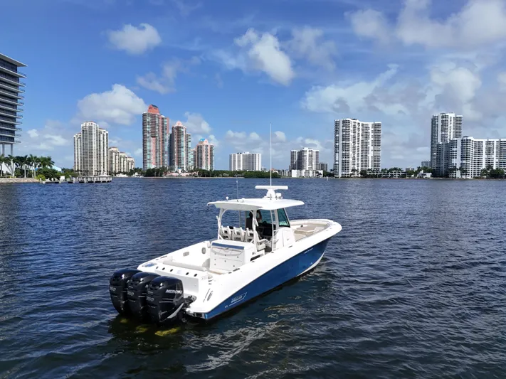  Yacht Photos Pics 2017 Boston Whaler 350 Outrage on water with city skyline background.