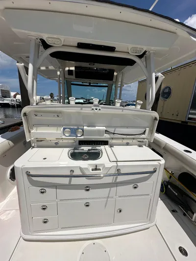  Yacht Photos Pics 2017 Boston Whaler 350 Outrage boat interior with storage and sink.