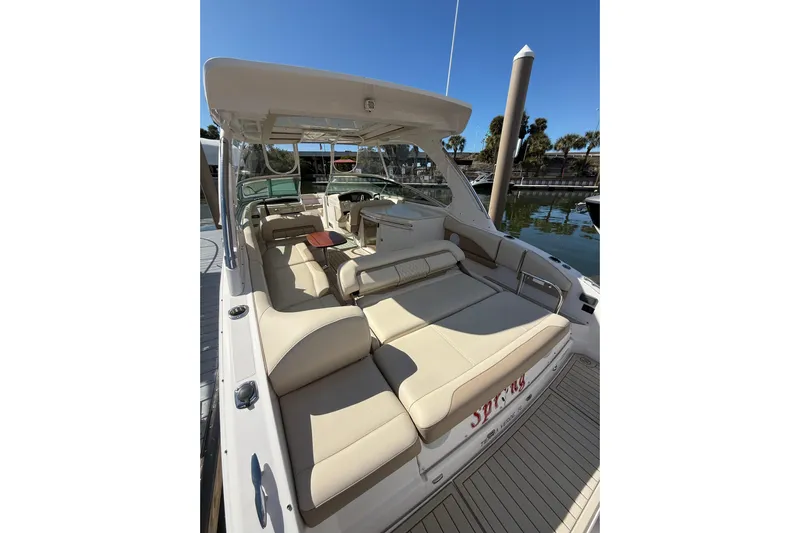  Yacht Photos Pics 2018 Regal 33 OBX boat with spacious seating at a marina dock.