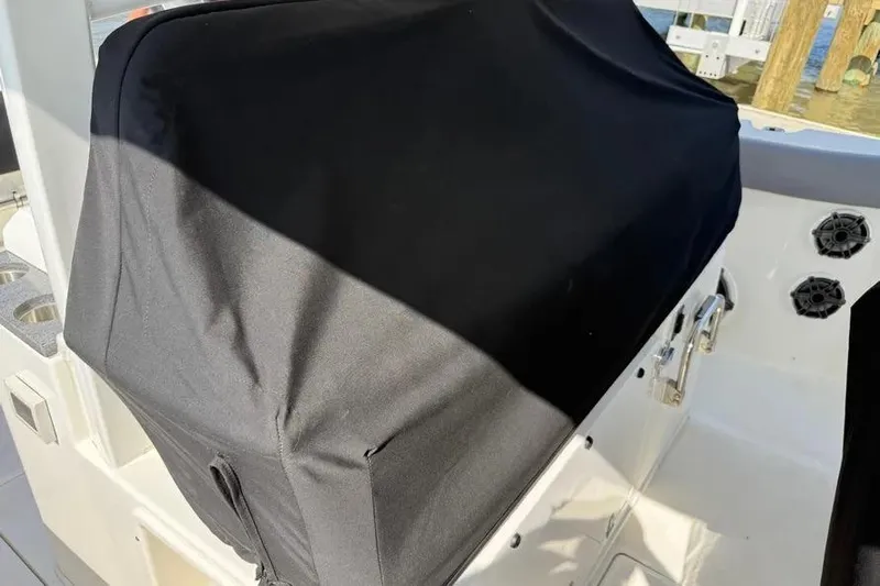  Yacht Photos Pics 2024 Boston Whaler 380 Outrage console covered with black protective fabric.