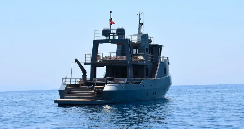 Risk Taker Yacht Photos Pics Tansu Custom Trawler 2006 yacht on calm sea, rear view.