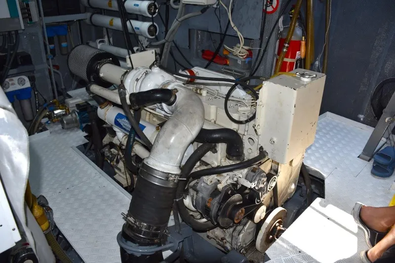 Risk Taker Yacht Photos Pics Engine room of a 2006 Tansu Custom Trawler, showcasing mechanical components and equipment.