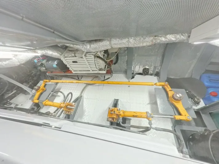 Risk Taker Yacht Photos Pics Engine room of 2006 Tansu Custom Trawler with visible mechanical components and insulation.