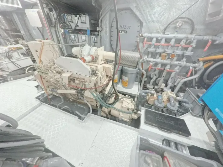 Risk Taker Yacht Photos Pics Engine room of a 2006 Tansu Custom Trawler, showcasing machinery and piping systems.