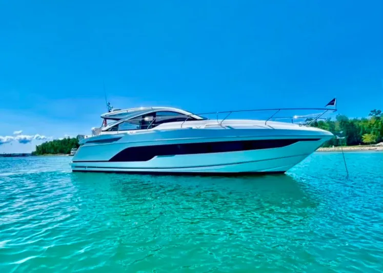  Yacht Photos Pics 2020 Fairline 45/43 Targa yacht on clear turquoise water under a bright blue sky.
