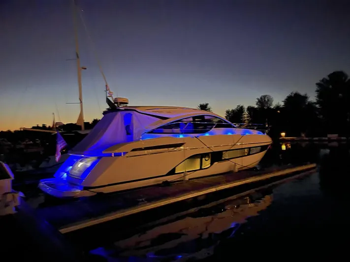  Yacht Photos Pics 2020 Fairline 45/43 Targa yacht illuminated with blue lights at dusk.
