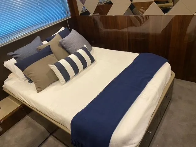  Yacht Photos Pics Luxurious bedroom interior of 2020 Fairline 45/43 Targa yacht with elegant bedding.