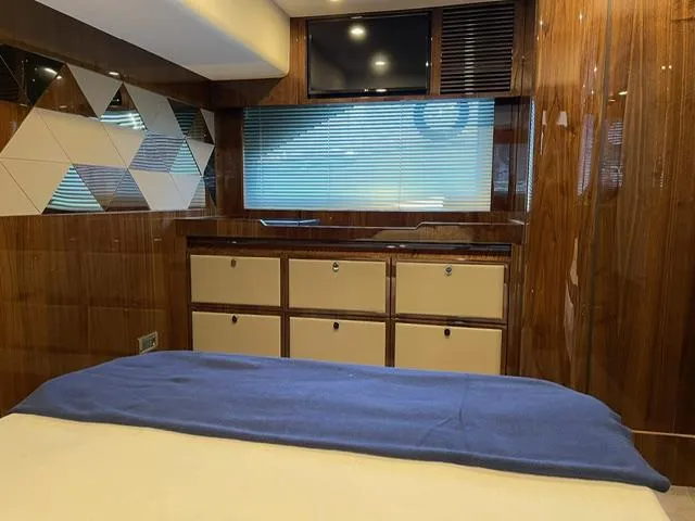  Yacht Photos Pics Interior of 2020 Fairline 45/43 Targa yacht, featuring wood paneling and modern cabinetry.