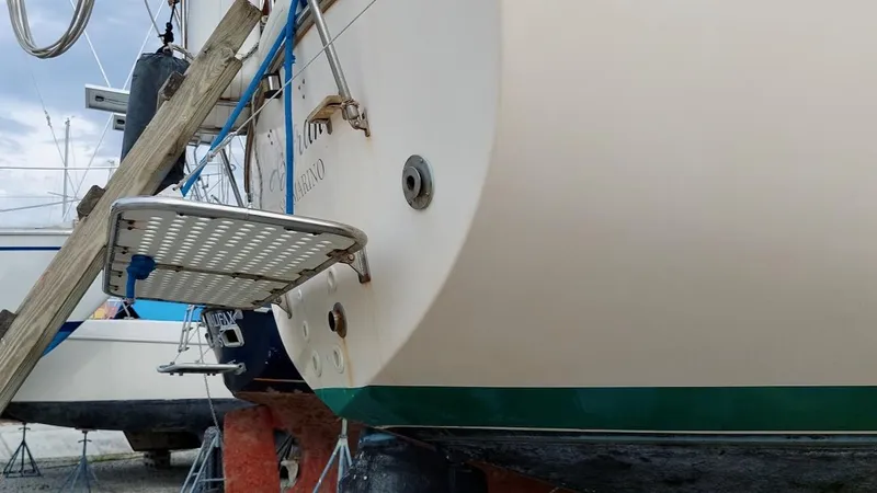 Azafran Yacht Photos Pics 1994 Island Packet 40 sailboat on dry dock, showcasing stern and swim platform.