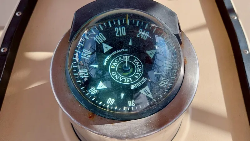Azafran Yacht Photos Pics Compass on 1994 Island Packet 40 yacht, displaying cardinal directions and degrees.