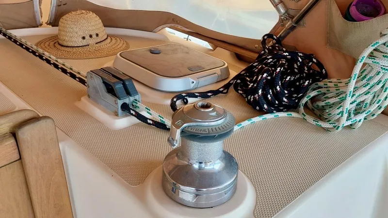 Azafran Yacht Photos Pics Deck of 1994 Island Packet 40 sailboat with winch, ropes, and a straw hat.