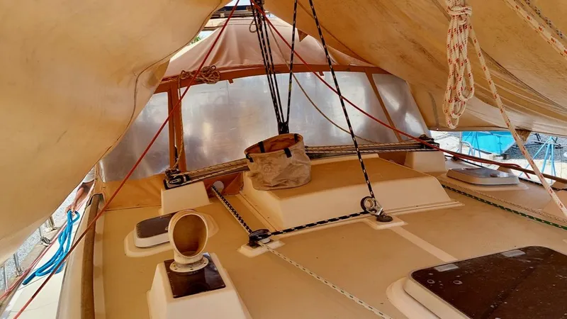 Azafran Yacht Photos Pics 1994 Island Packet 40 sailboat deck under tarp with ropes and fittings.
