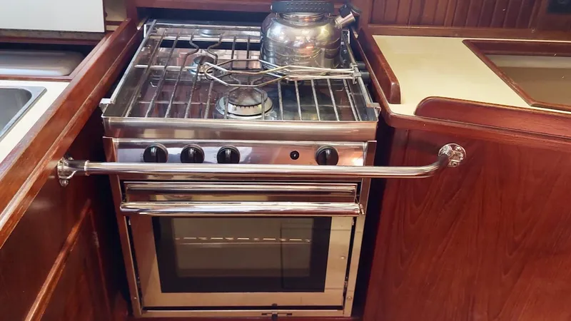 Azafran Yacht Photos Pics Stainless steel stove and oven in 1994 Island Packet 40 yacht kitchen.