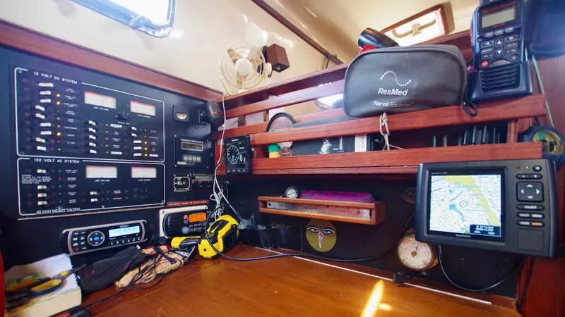 Azafran Yacht Photos Pics Navigation station of a 1994 Island Packet 40 sailboat with electronic equipment and controls.