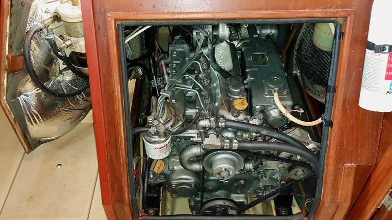 Azafran Yacht Photos Pics Engine compartment of a 1994 Island Packet 40 sailboat, featuring a Yanmar engine.